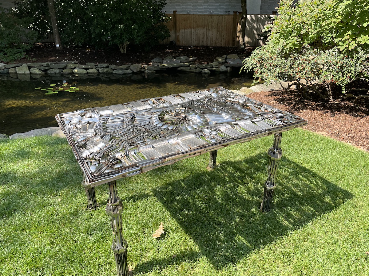 photo of table made out of cutlery at Northeastern