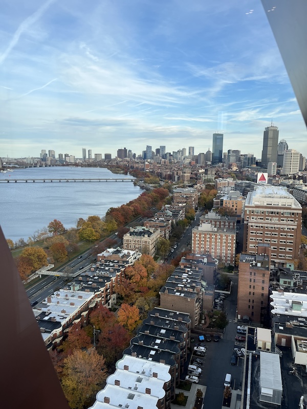 photo out window high above picturesque view down Charles River towards Boston