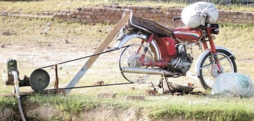 a motorcycle driving a water pump