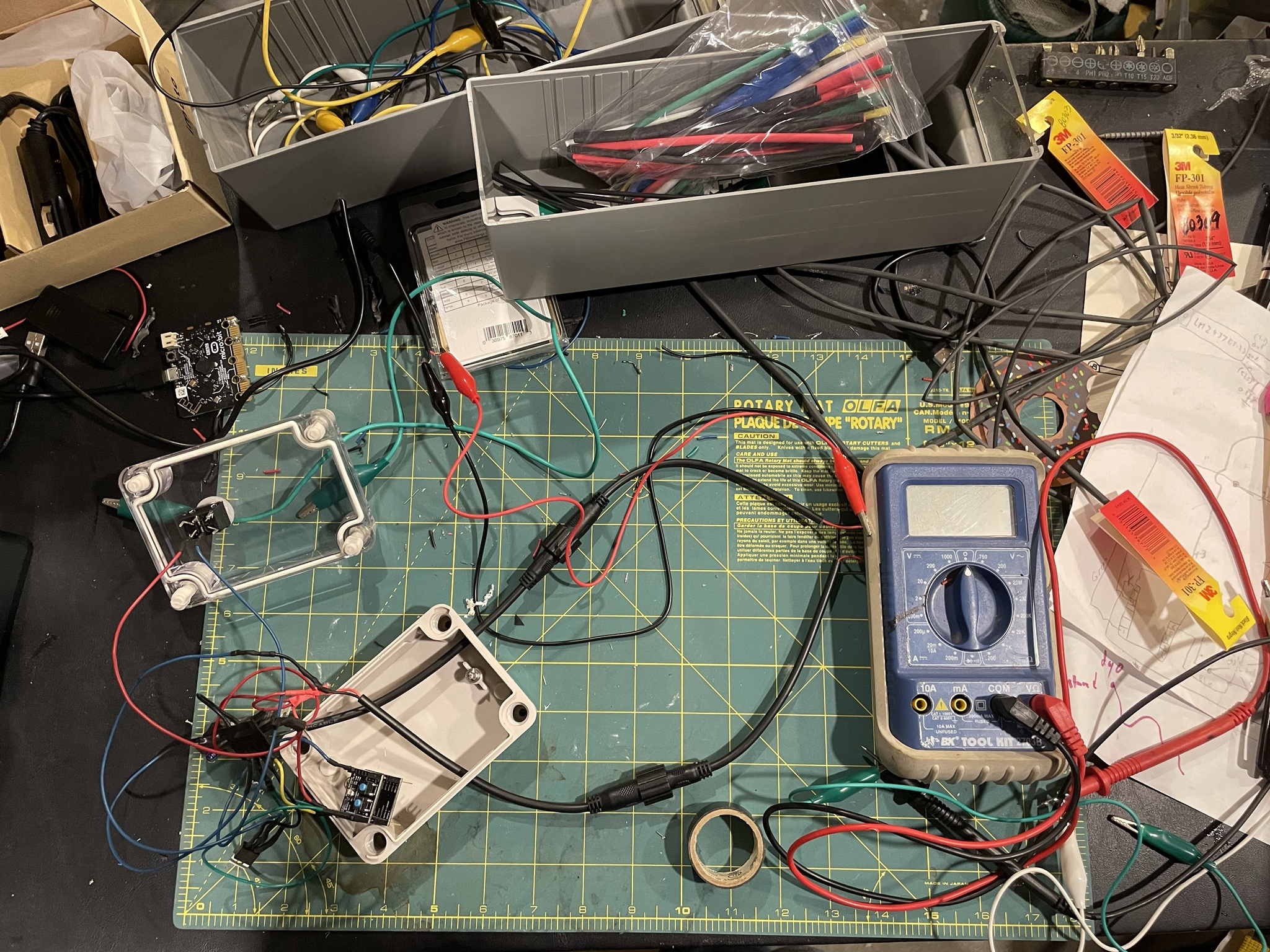 view of a table from above with scattered electronics parts and wires