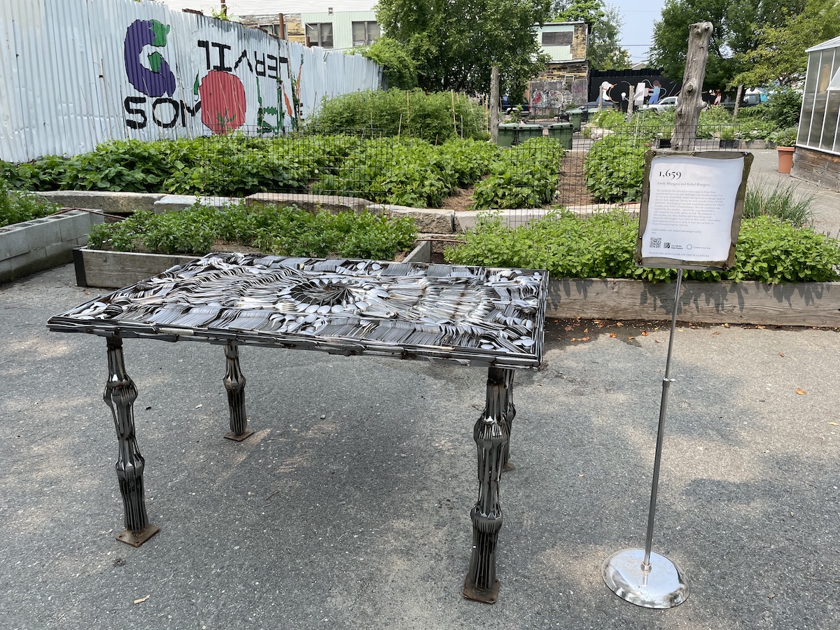 photo of table made out of cutlery at an urban farm